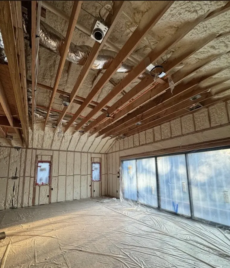 Interior walls and ceiling insulated with spray foam during new construction in Silvis
